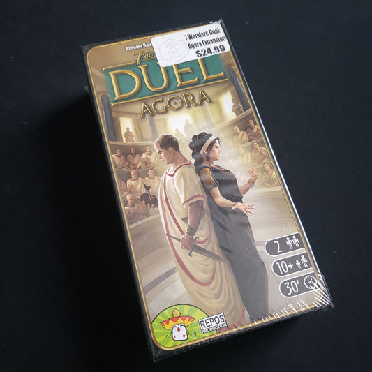 Image shows the front cover of the box of the Agora expansion for the board game 7 Wonders Duel