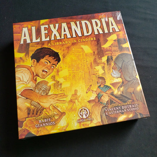 Image shows the front cover of the box of the Alexandria: A Library in Cinders board game