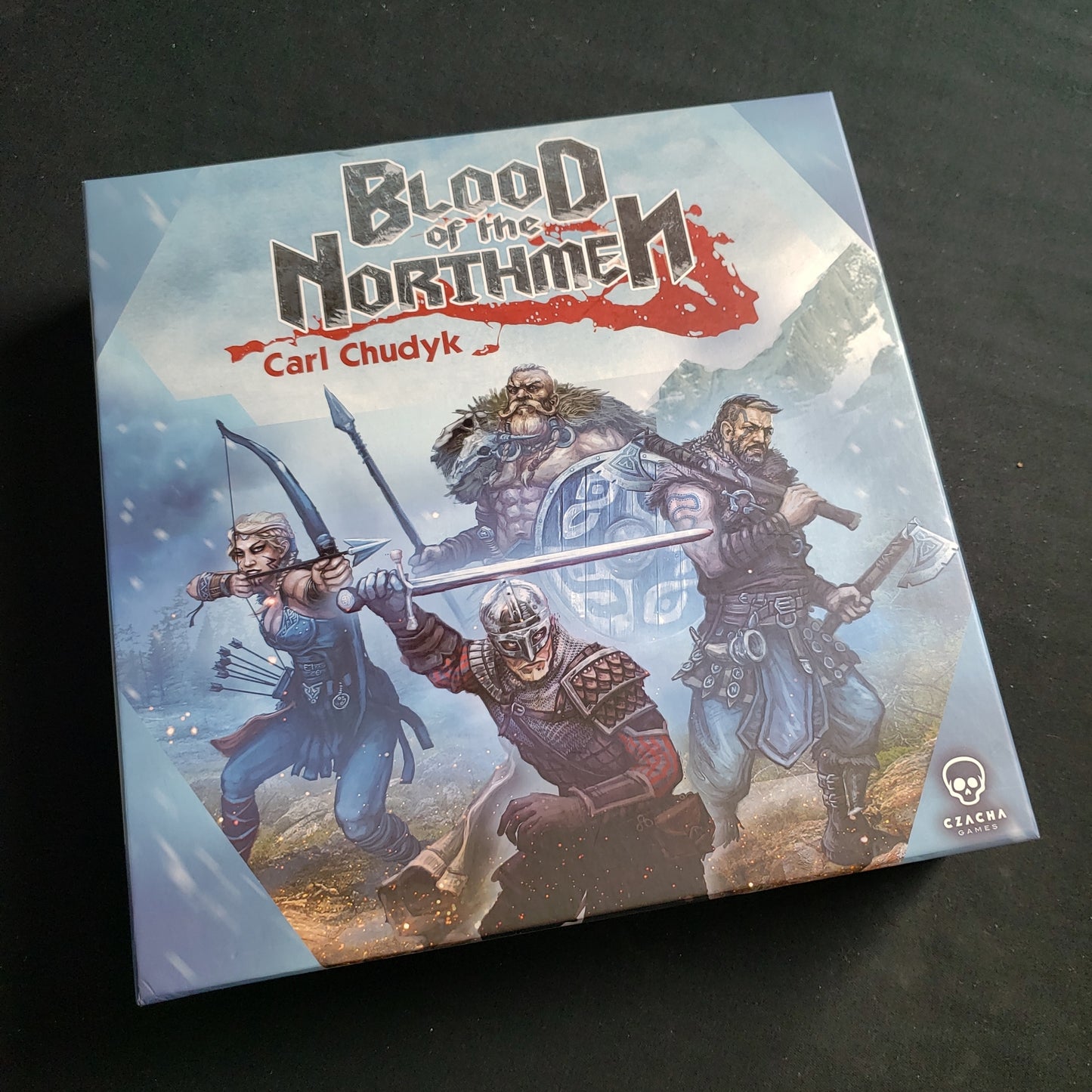 Image shows the front cover of the box of the Blood of the Northmen board game