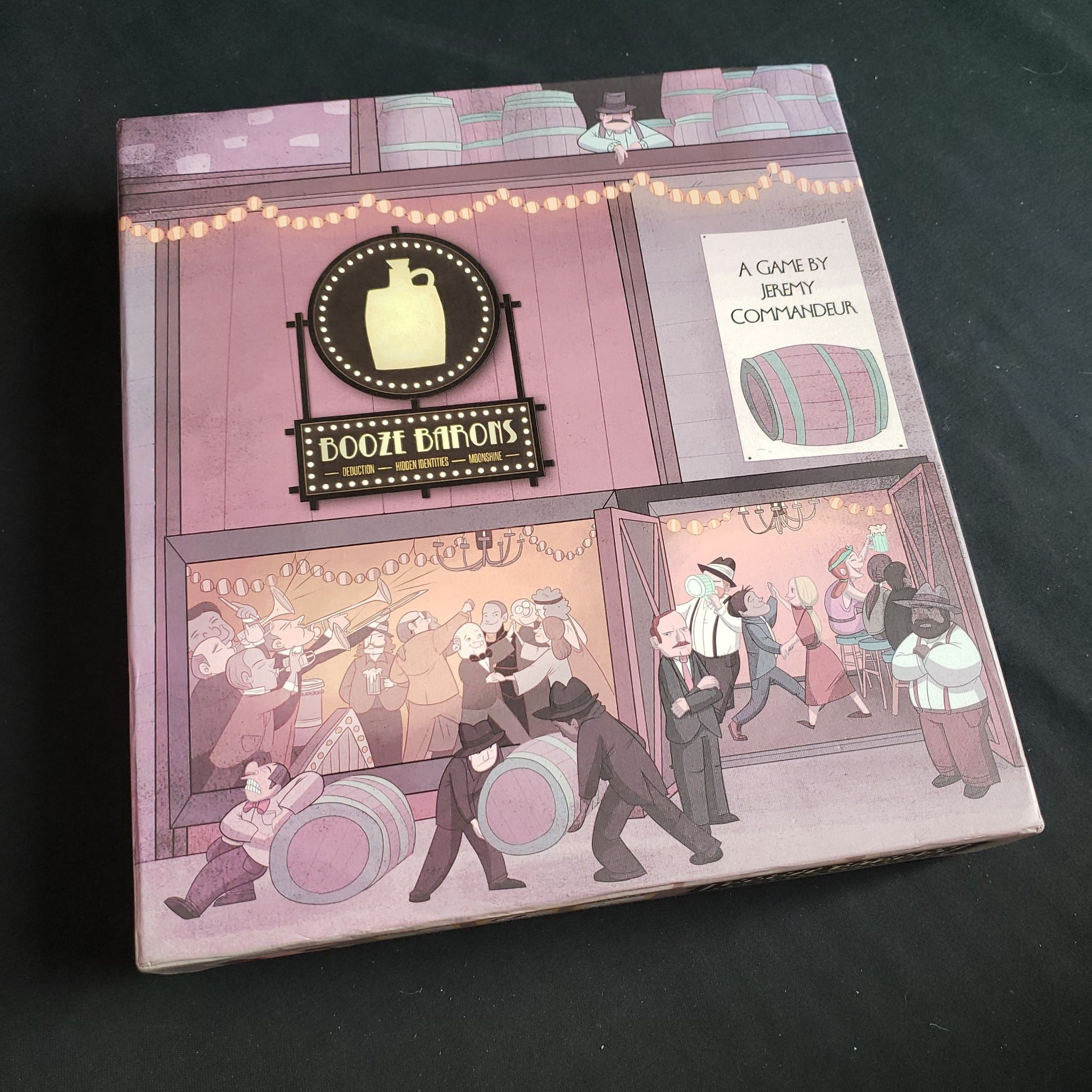 Image shows the front cover of the box of the Booze Barons board game