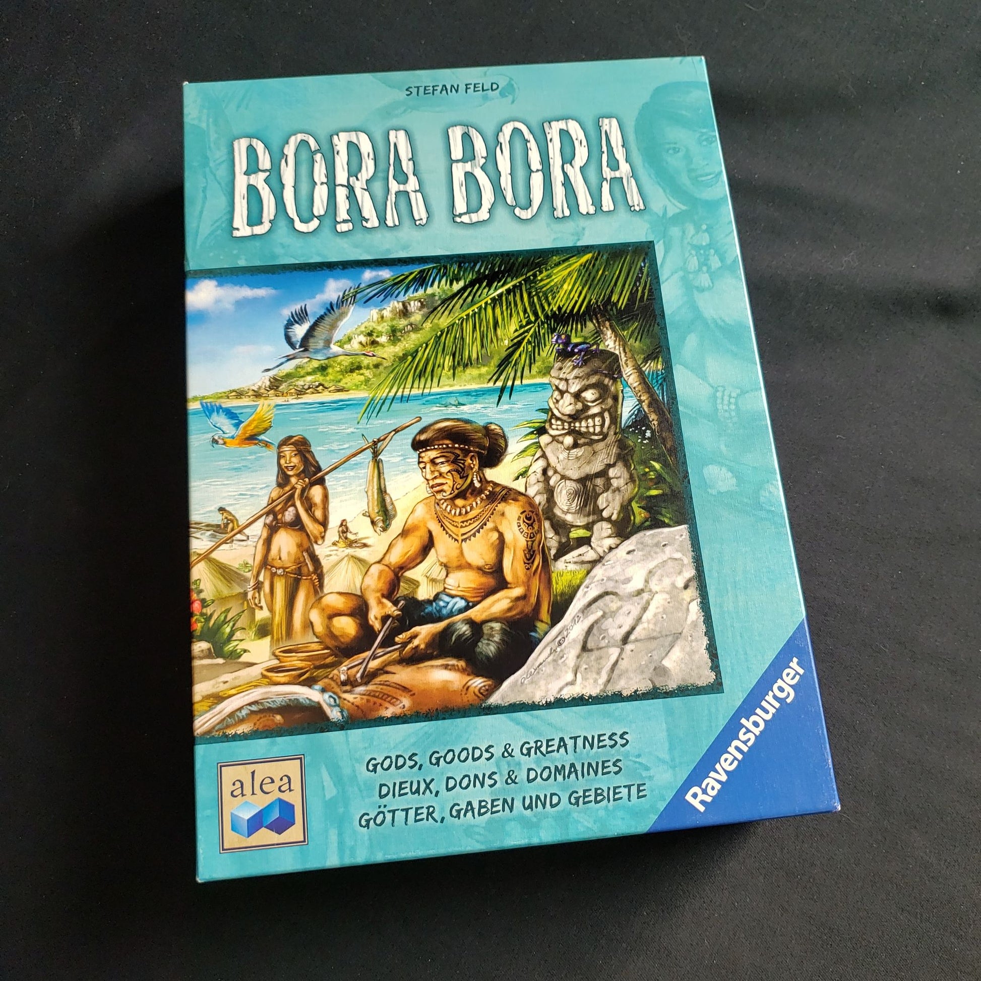 Image shows the front cover of the box of the Bora Bora board game