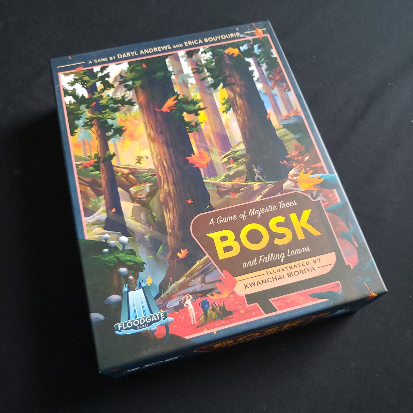 Image shows the front cover of the box of the Bosk board game