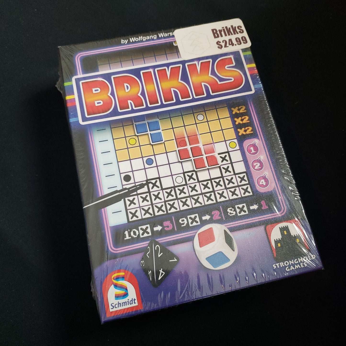 Image shows the front cover of the box of the Brikks dice game