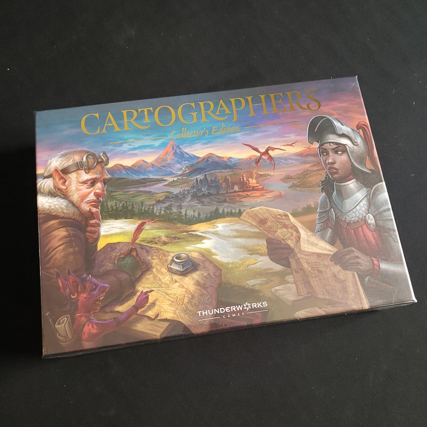 Image shows the front cover of the box of the Cartographers Heroes: Collector's Edition board game