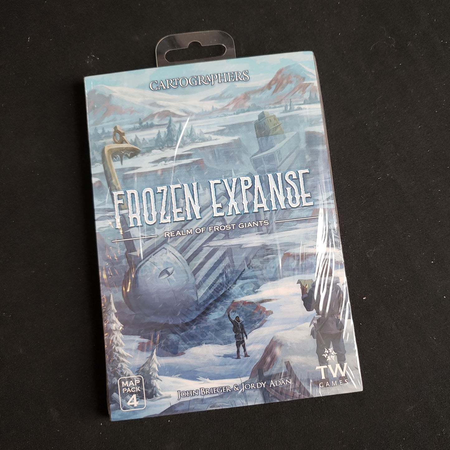 Image shows the front of the package for the Frozen Expanse expansion for the Cartographers game