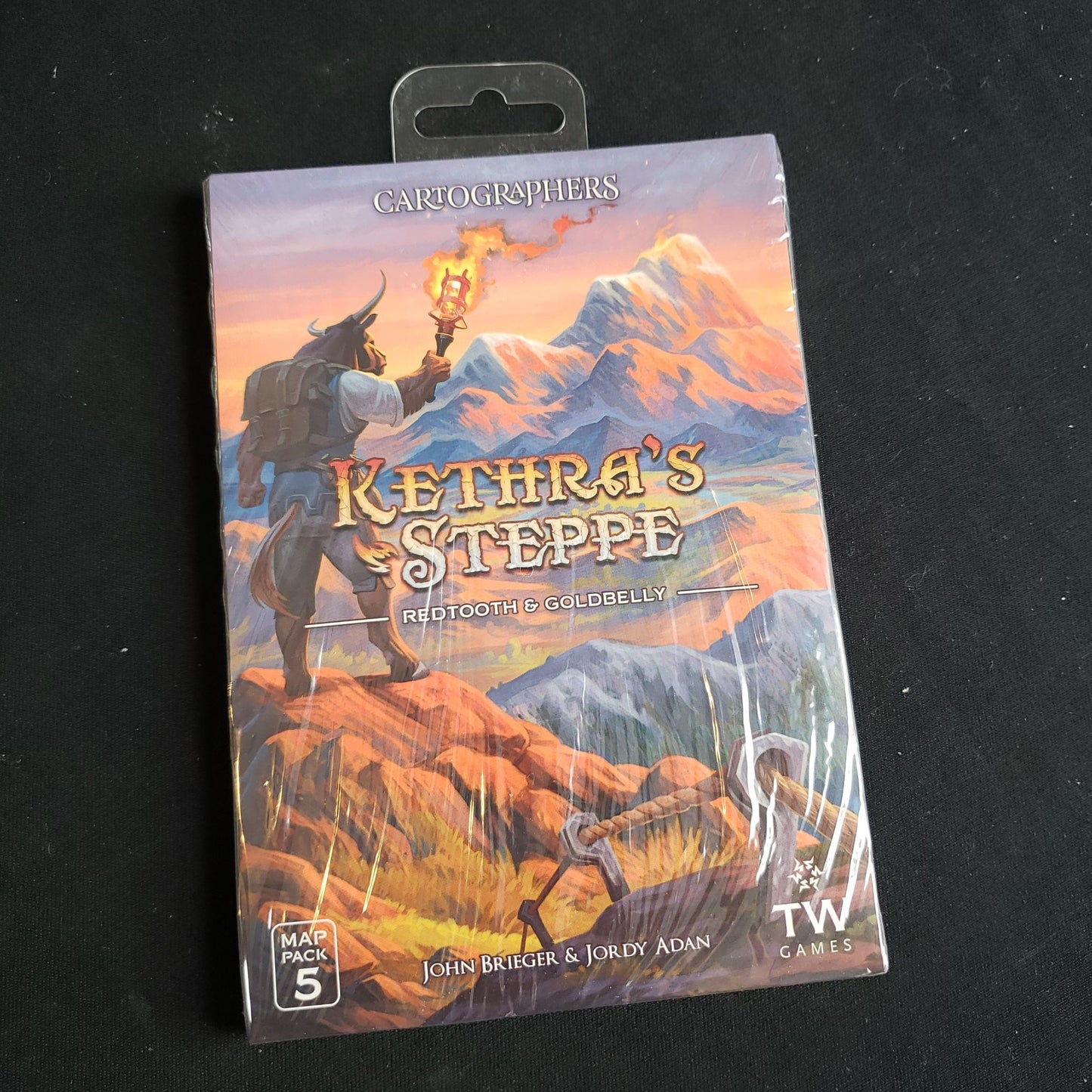Image shows the front of the package for the Kethra's Steppe expansion for the Cartographers game