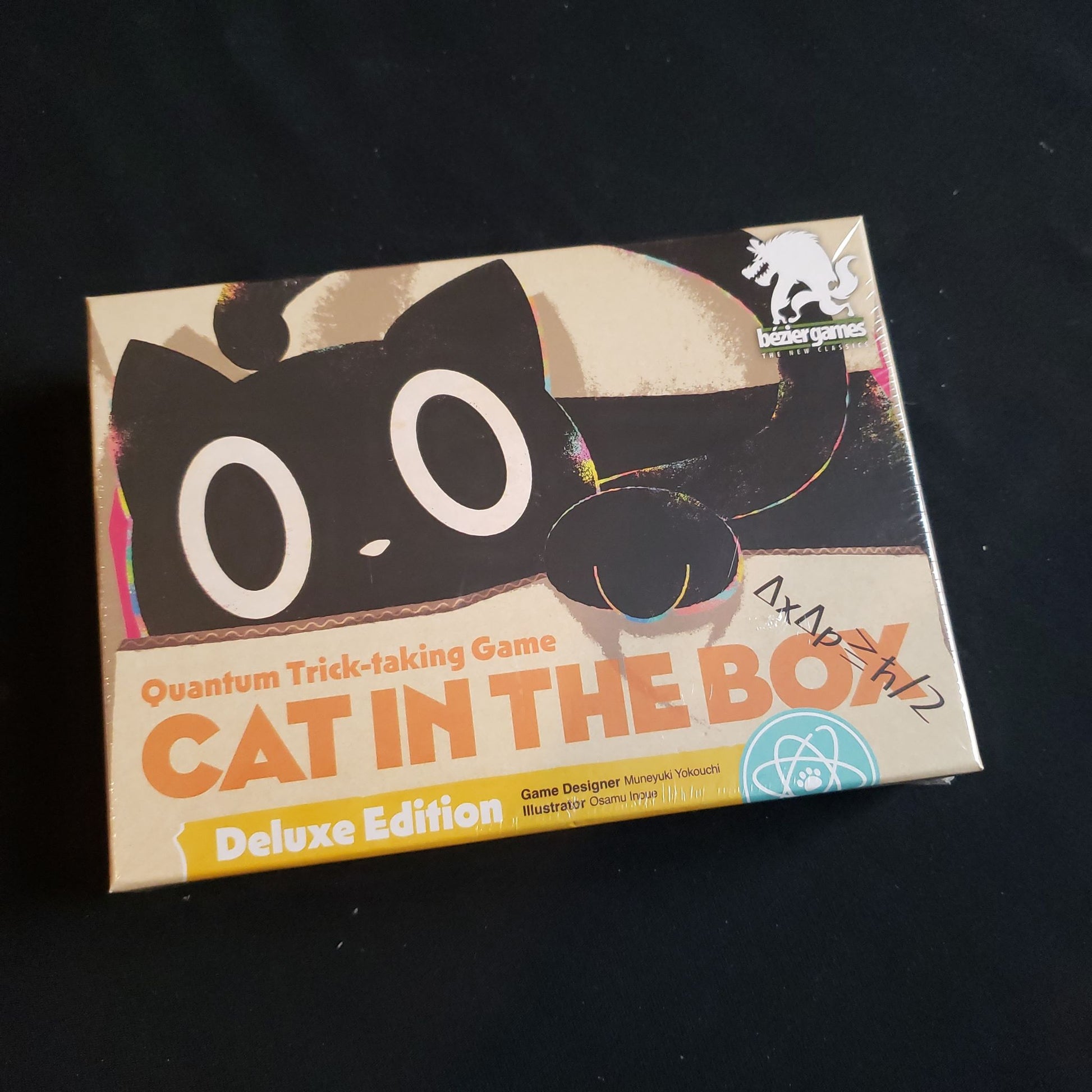 Image shows the front cover of the box of the Cat In The Box Deluxe edition card game