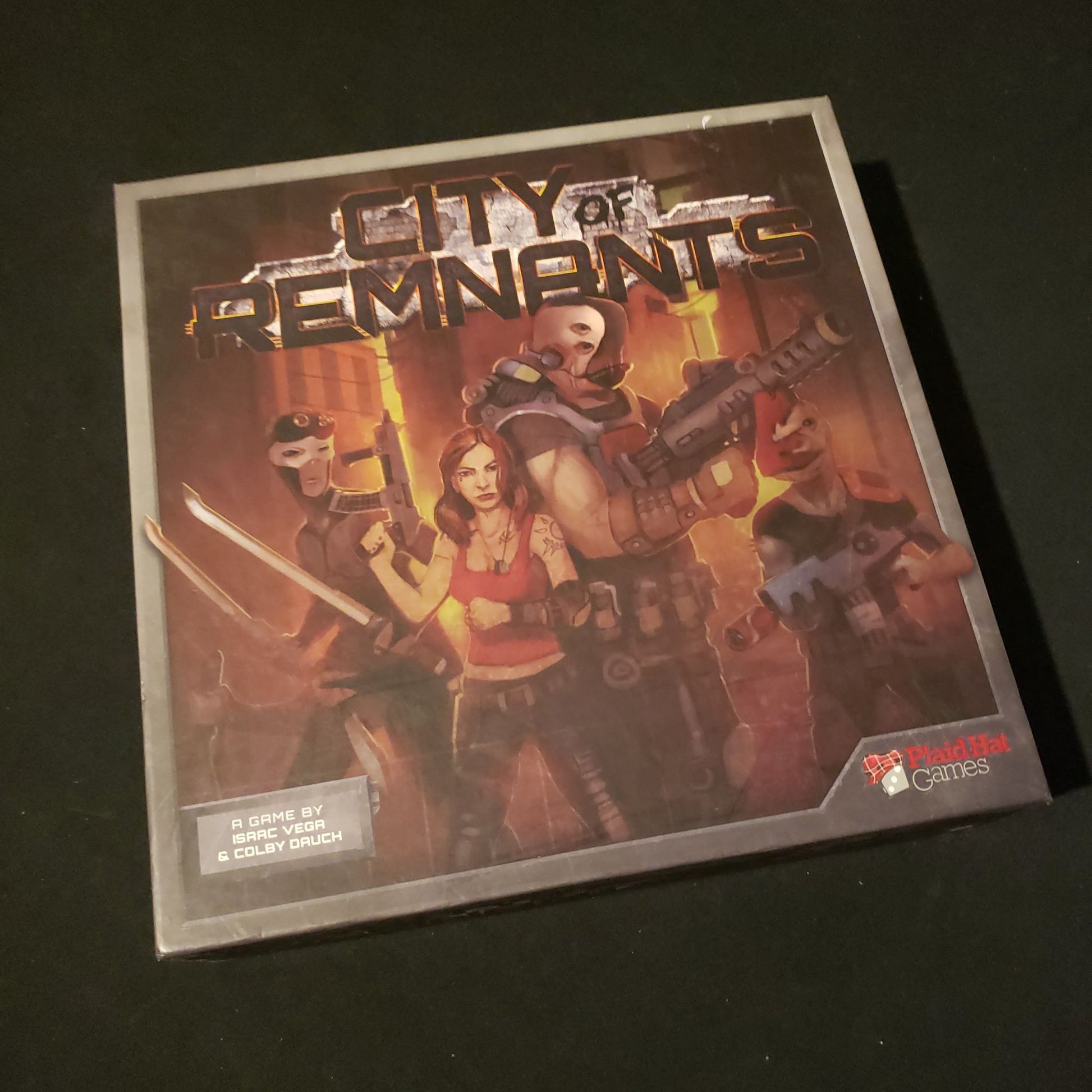 Image shows the front cover of the box of the City of Remnants board game