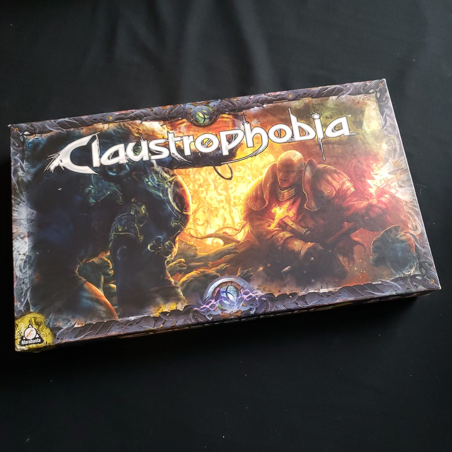 Image shows the front cover of the box of the Claustrophobia board game