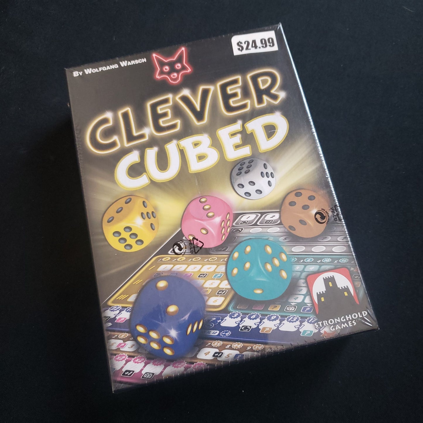 Image shows the front cover of the box of the Clever Cubed dice game