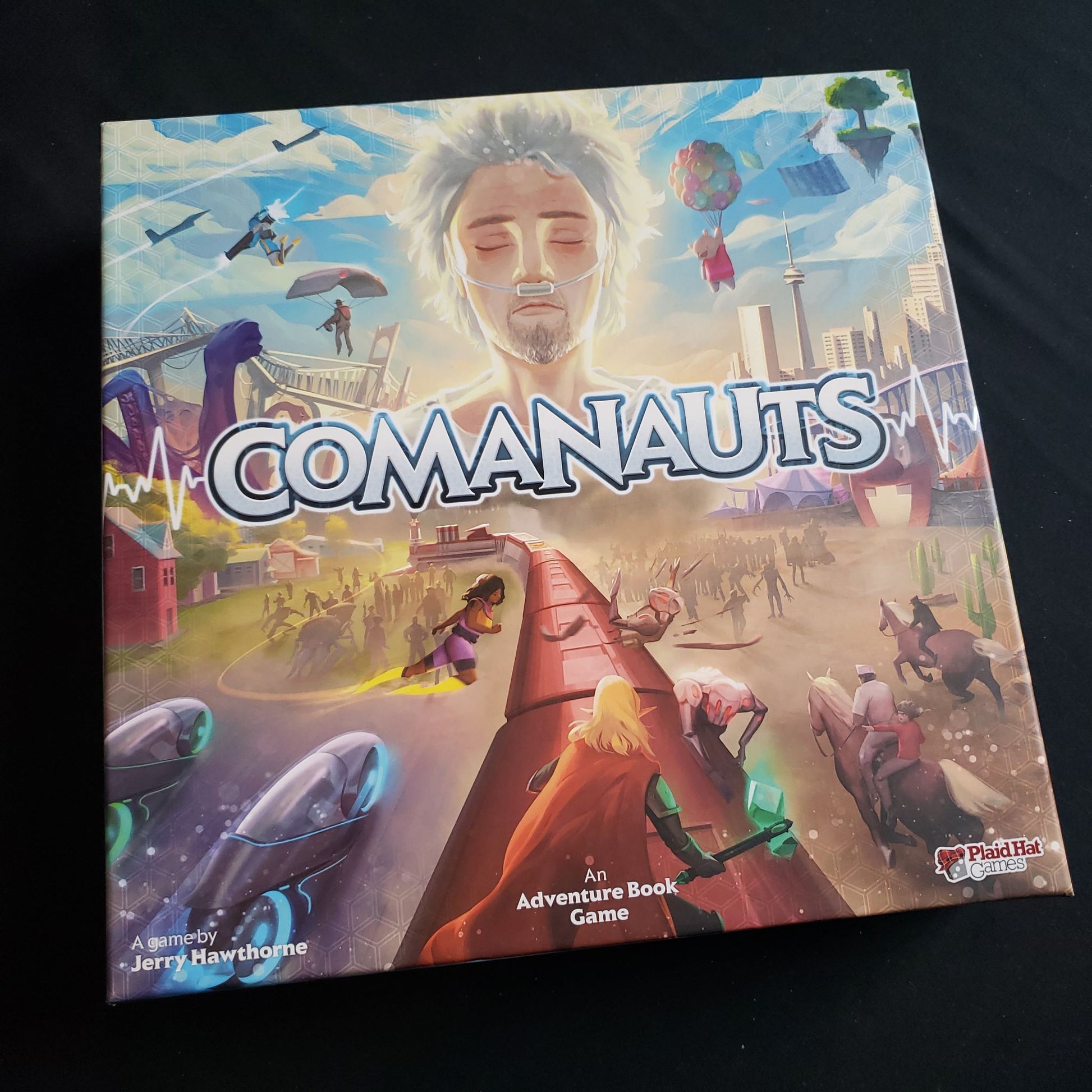 Image shows the front cover of the box of the Comanauts board game