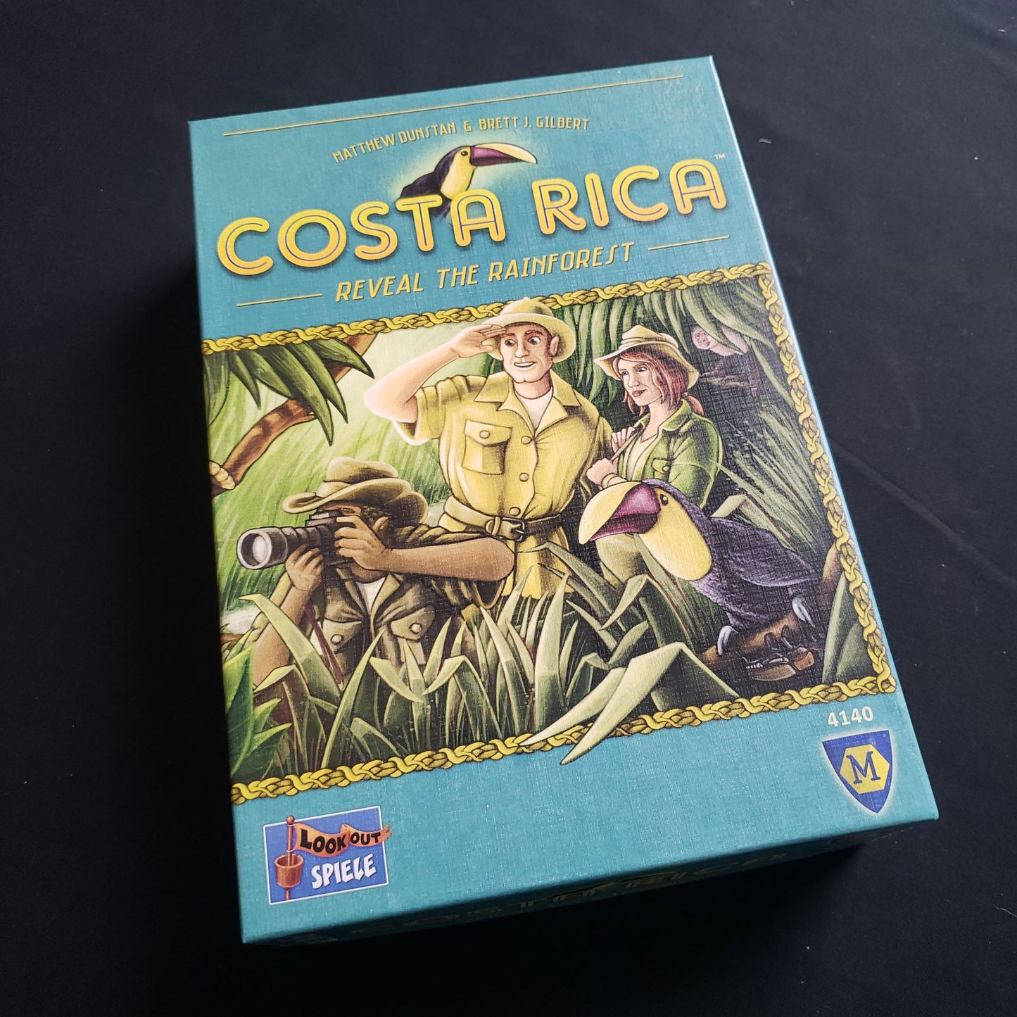 Image shows the front cover of the box of the Costa Rica board game