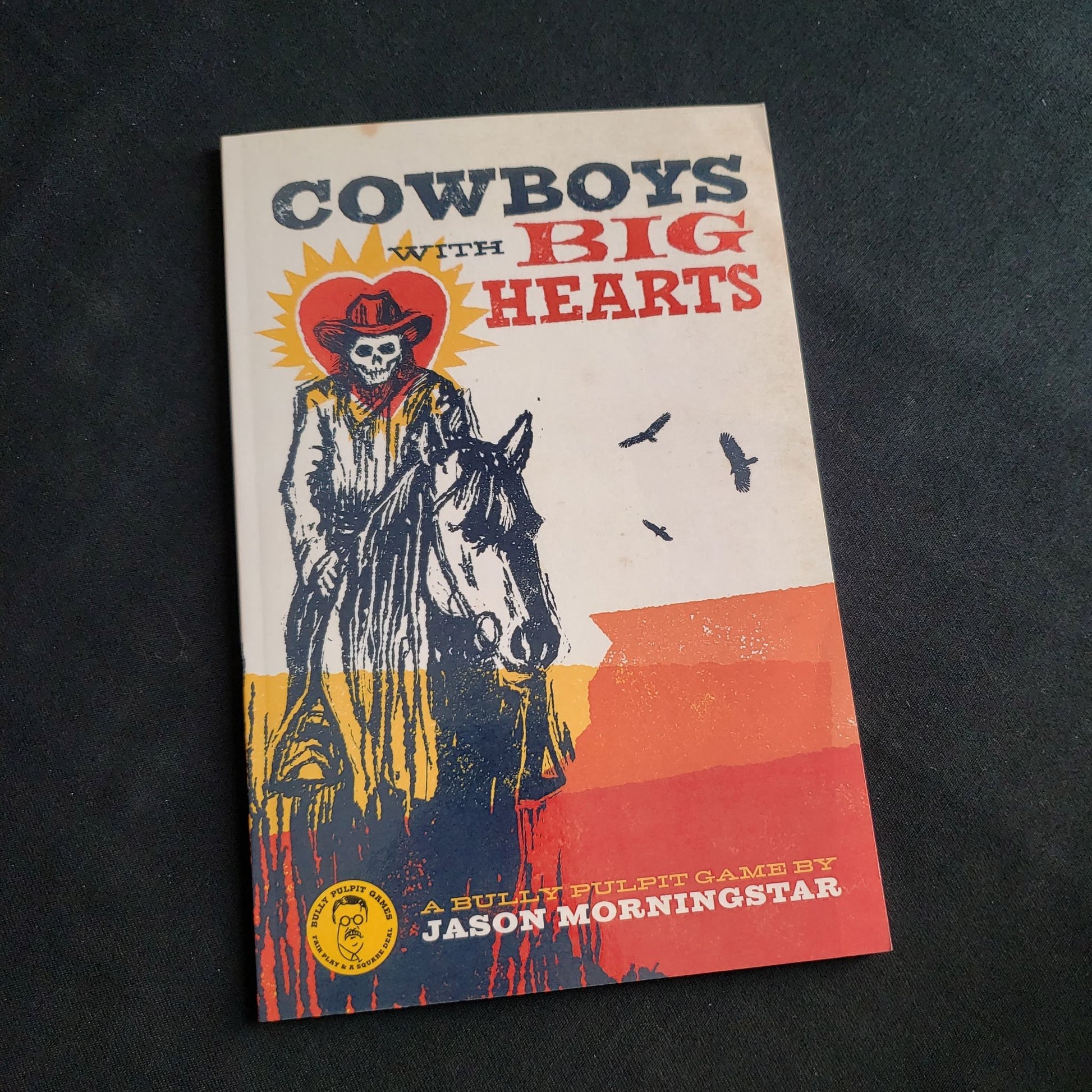 Image shows the front cover of the Cowboys With Big Hearts roleplaying game book