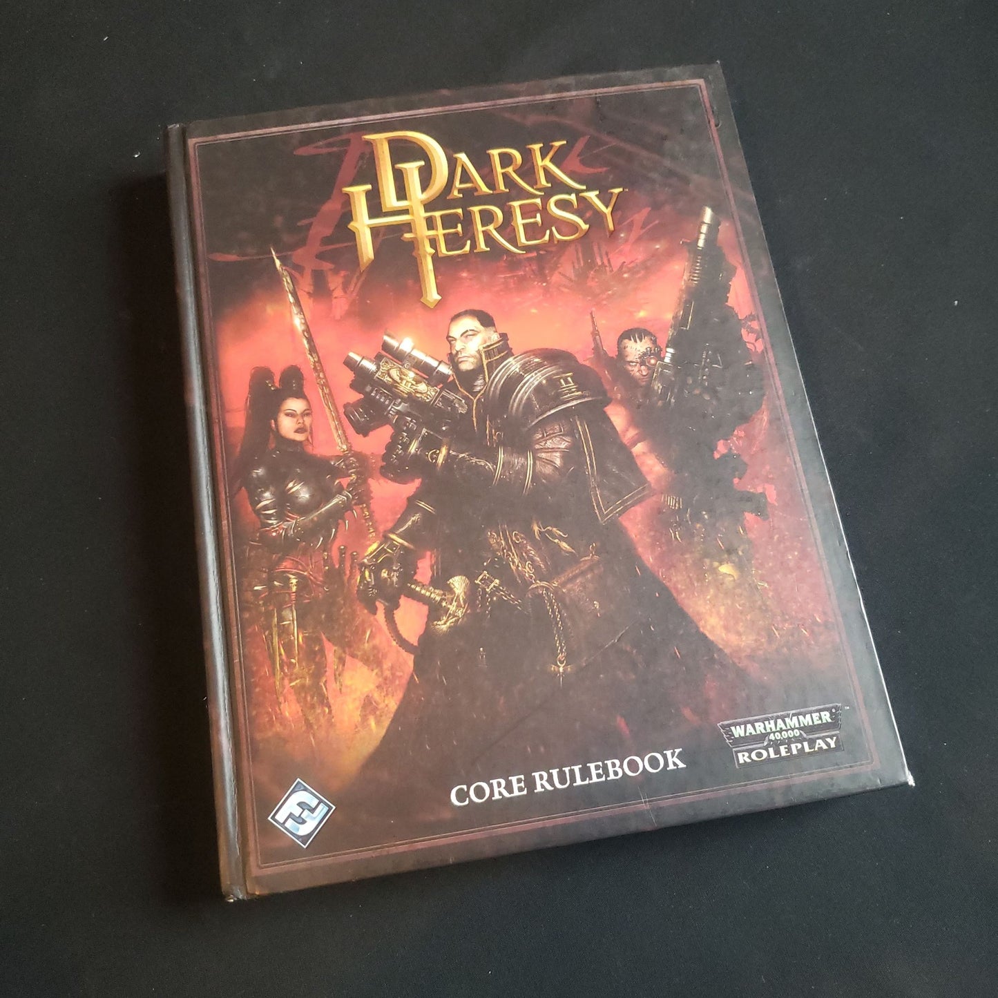 Front cover of the first edition core rulebook for the Dark Heresy roleplaying game