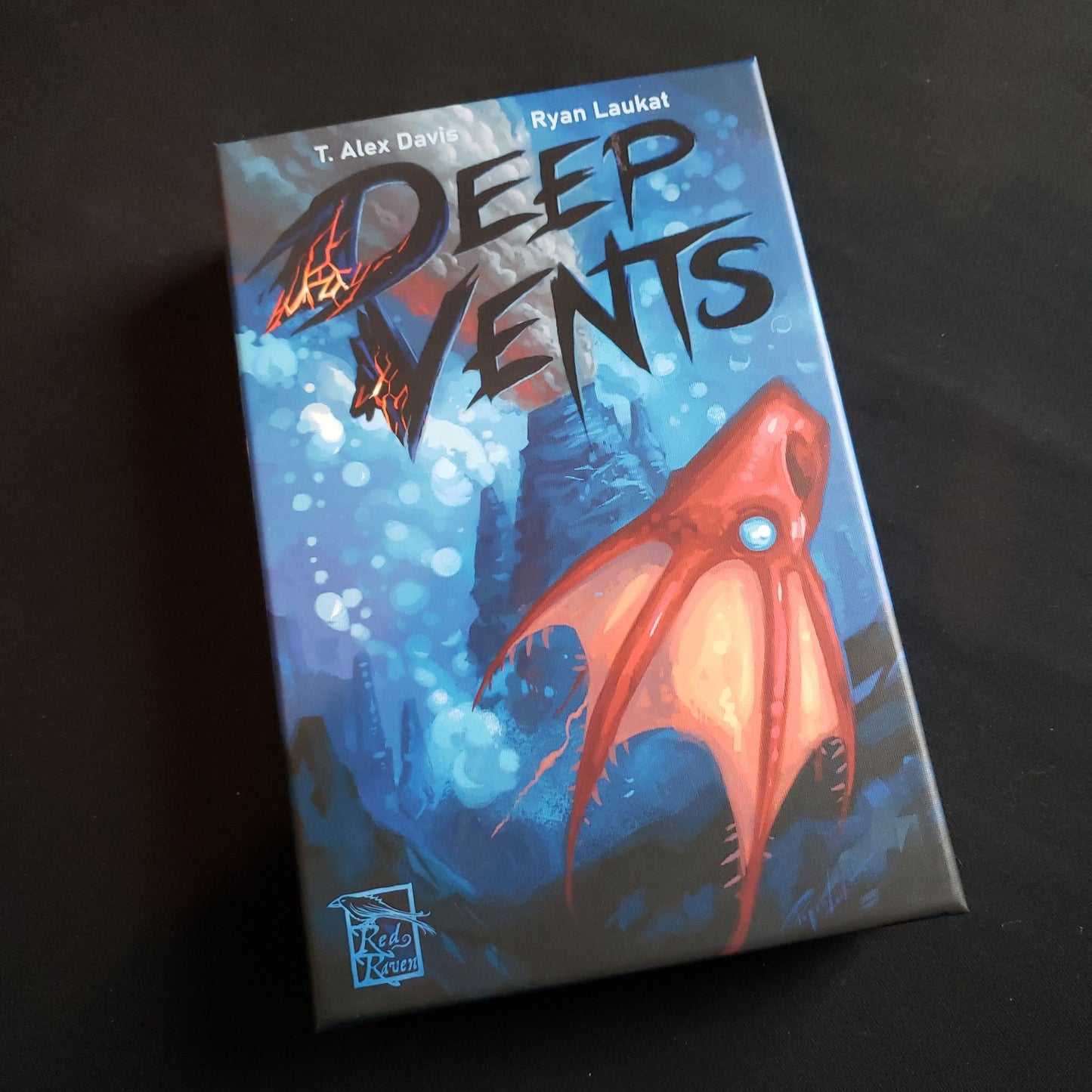 Image shows the front cover of the box of the Deep Vents board game