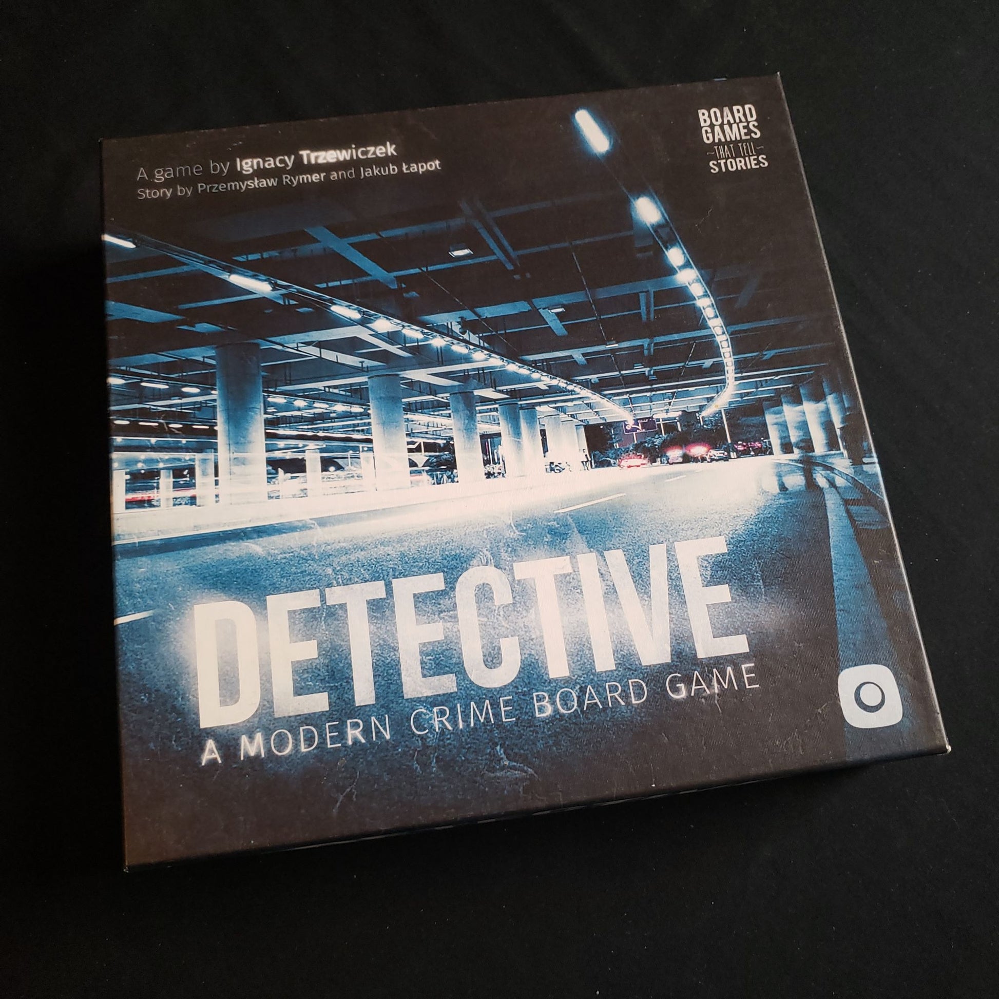 Image shows the front cover of the box of the Detective board game