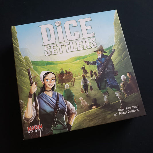 Image shows the front cover of the box of the Dice Settlers  board game