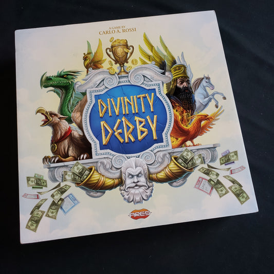 Image shows the front cover of the box of the Divinity Derby board game