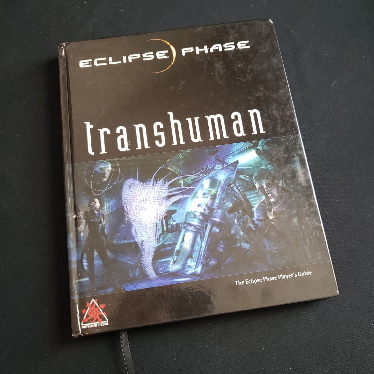 Image shows the front cover of the Transhuman book for the Eclipse Phase roleplaying game
