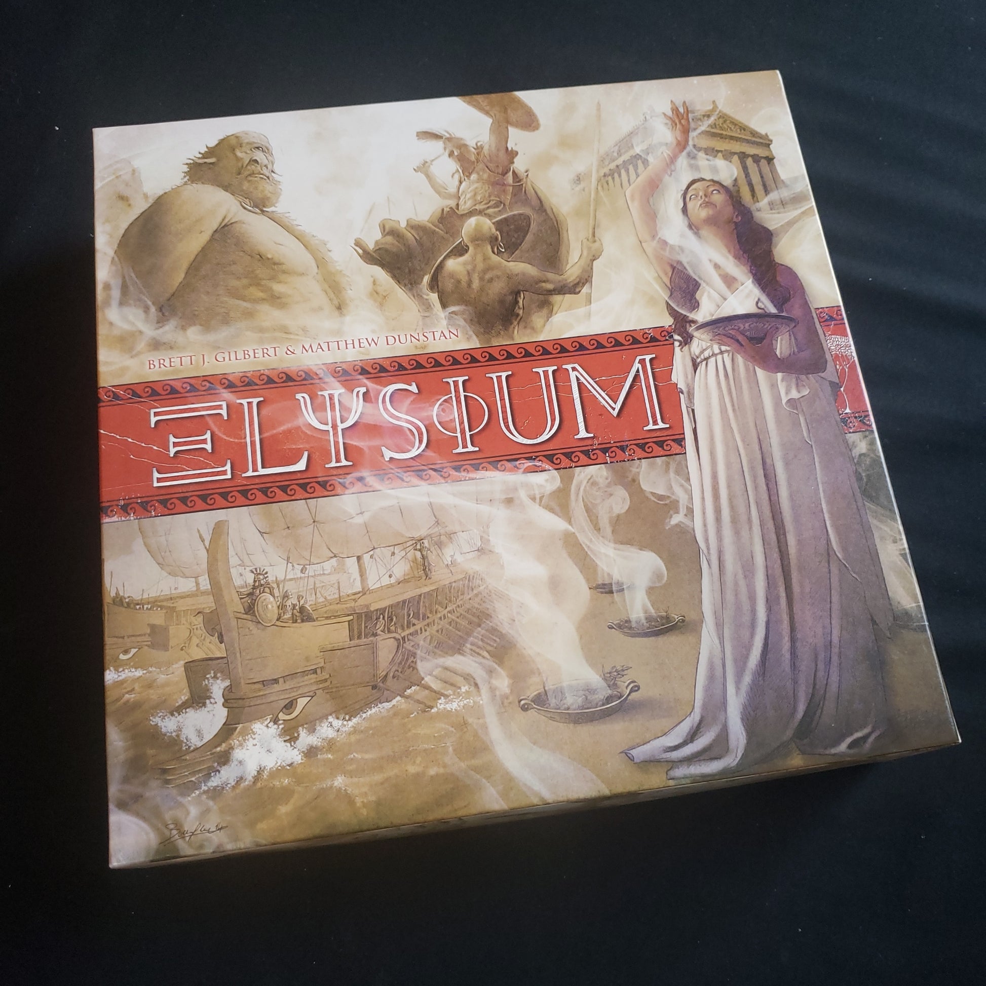 Image shows the front cover of the box of the Elysium board game