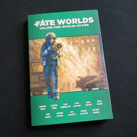 Image shows the front cover of the Worlds on Fire book for the Fate Core roleplaying game
