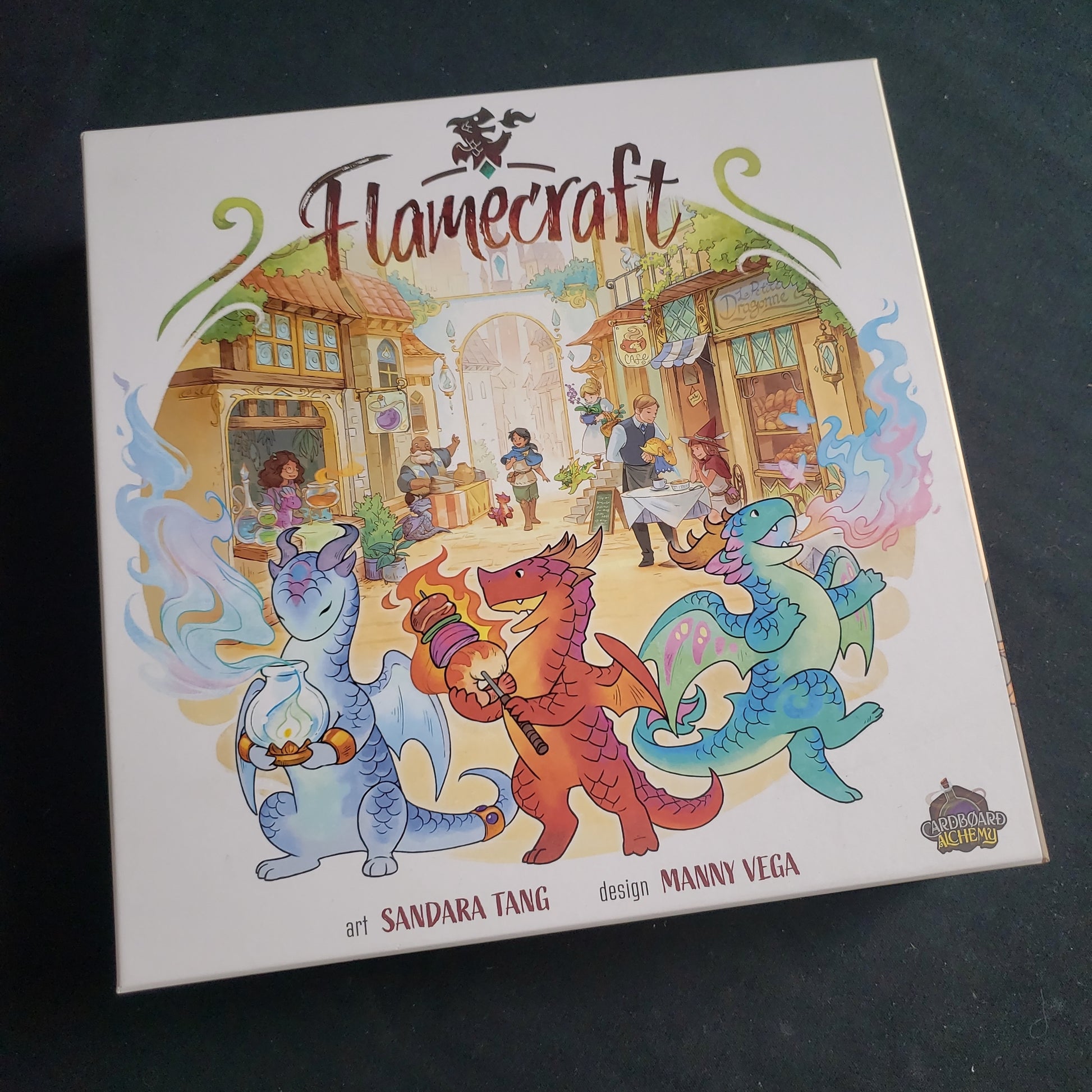 Image shows the front cover of the box of the Flamecraft board game