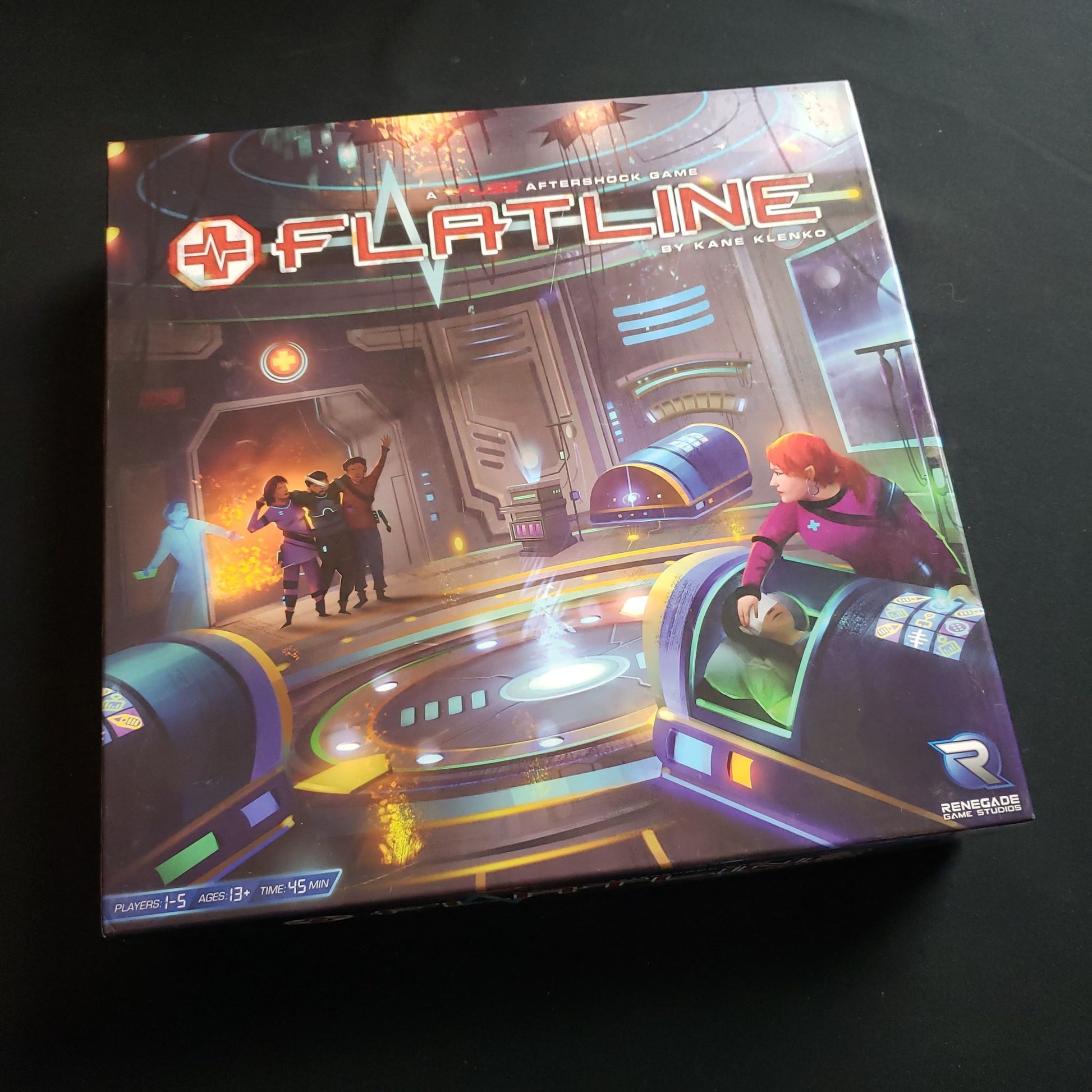 Image shows the front cover of the box of the Flatline board game