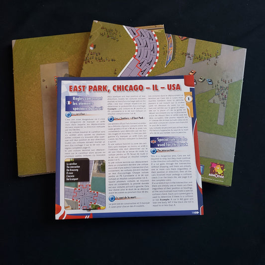 Image shows the two boards and instructions for the Circuit 1 expansion for the Formula De board game