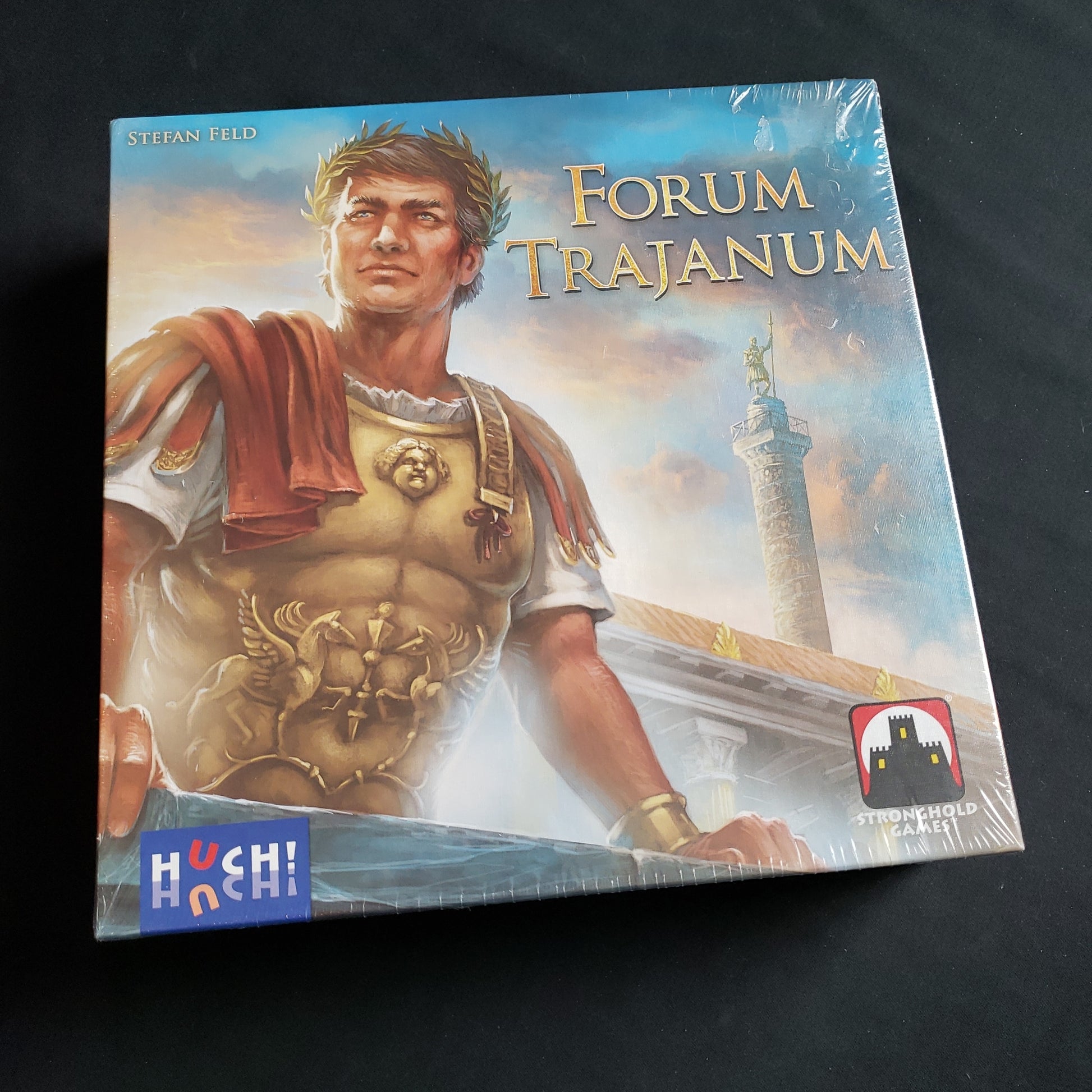 Image shows the front cover of the box of the Forum Trajanum board game