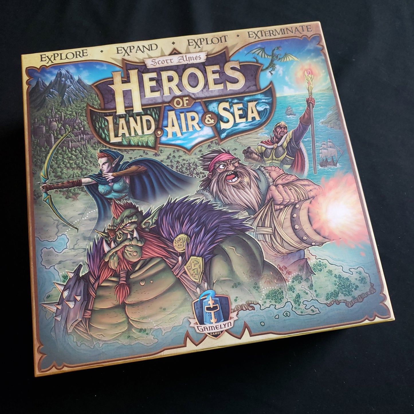 Image shows the front cover of the box of the Heroes of Land, Air & Sea board game