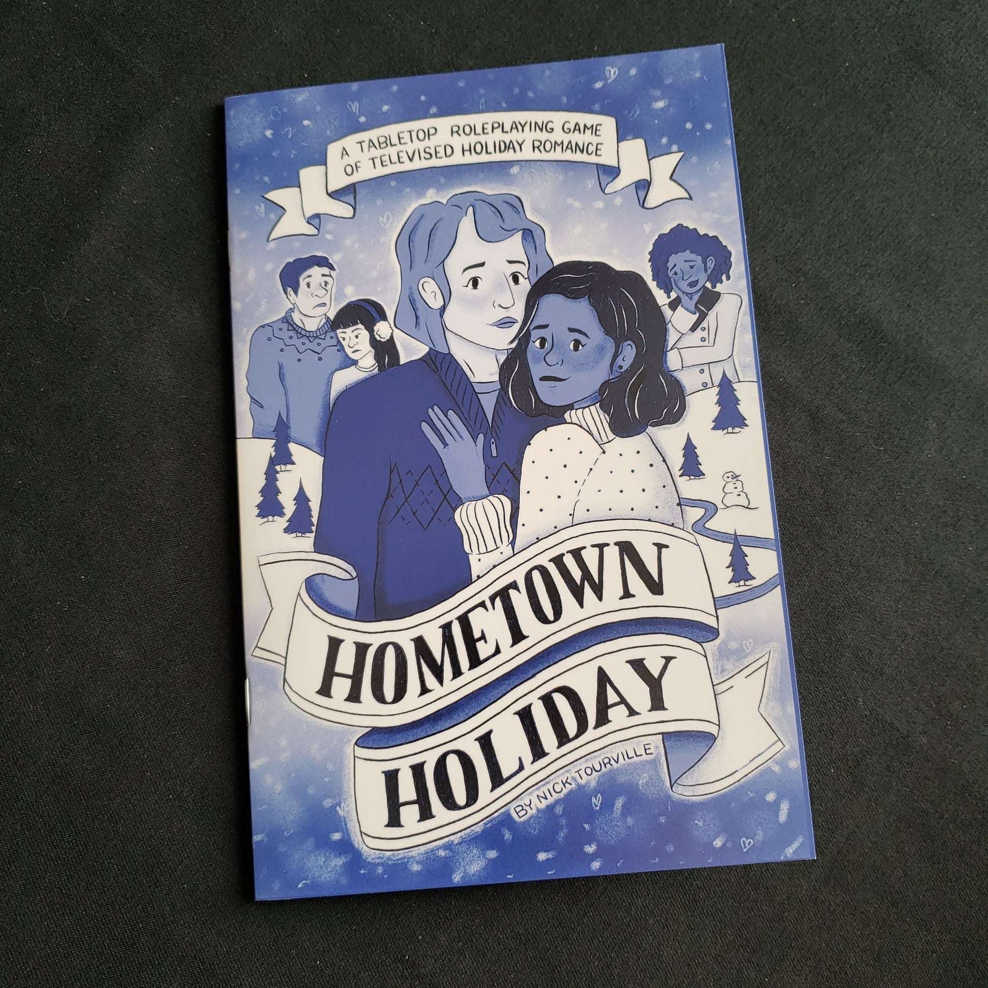 Image shows the front cover of the Hometown Holiday roleplaying game book