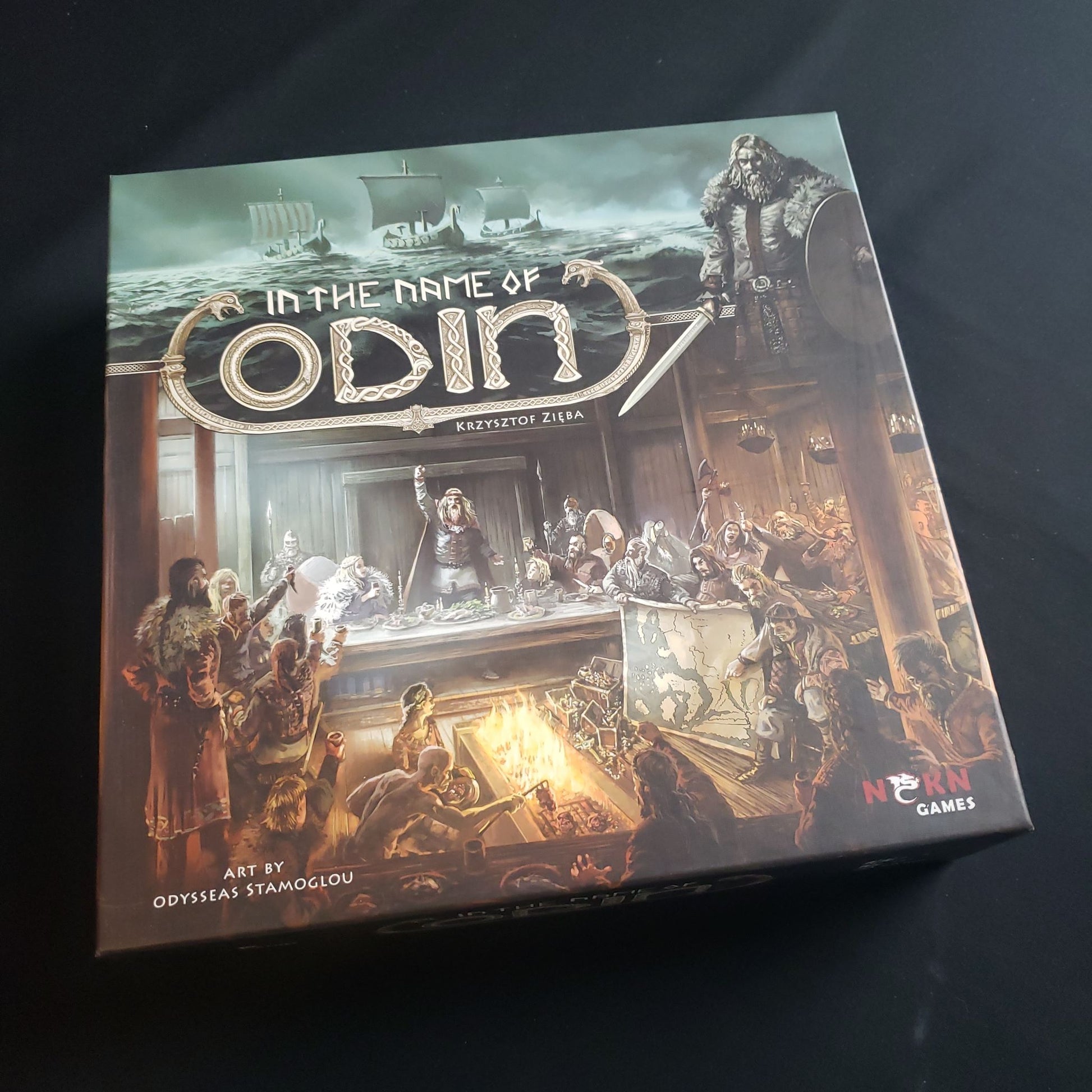 Image shows the front cover of the box of the In The Name Of Odin board game