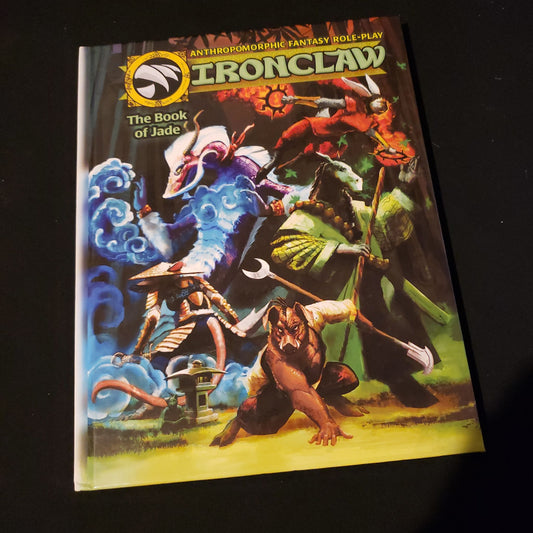 Image shows the front cover of the Book Of Jade for the Ironclaw roleplaying game