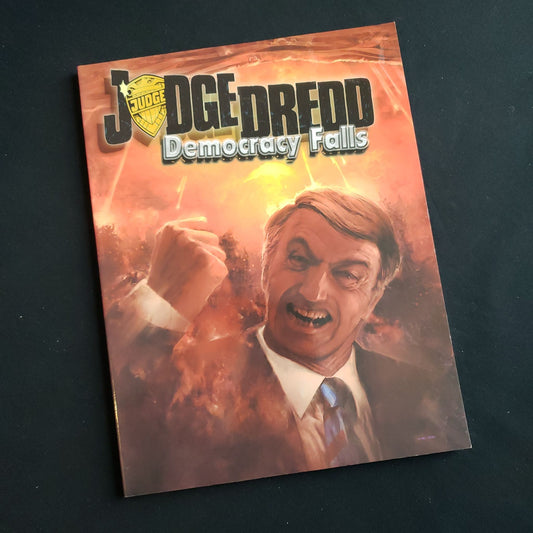 Image shows the front cover of the Democracy Falls book for the Judge Dredd Traveller roleplaying game