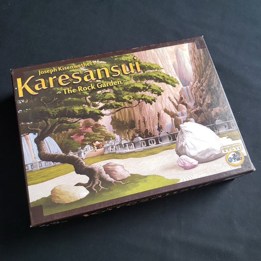 Image shows the front cover of the box of the Karesansui board game