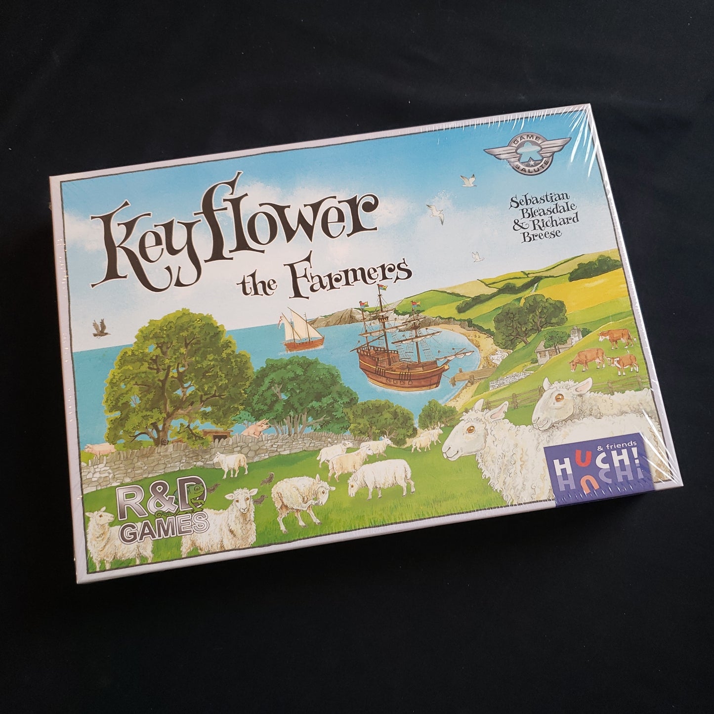 Image shows the front cover of the box of the Farmers expansion for the Keyflower board game