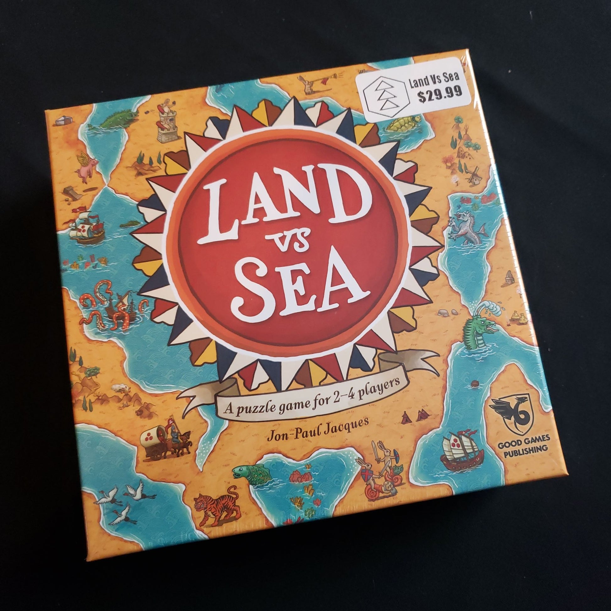 Image shows the front cover of the box of the Land Vs Sea board game