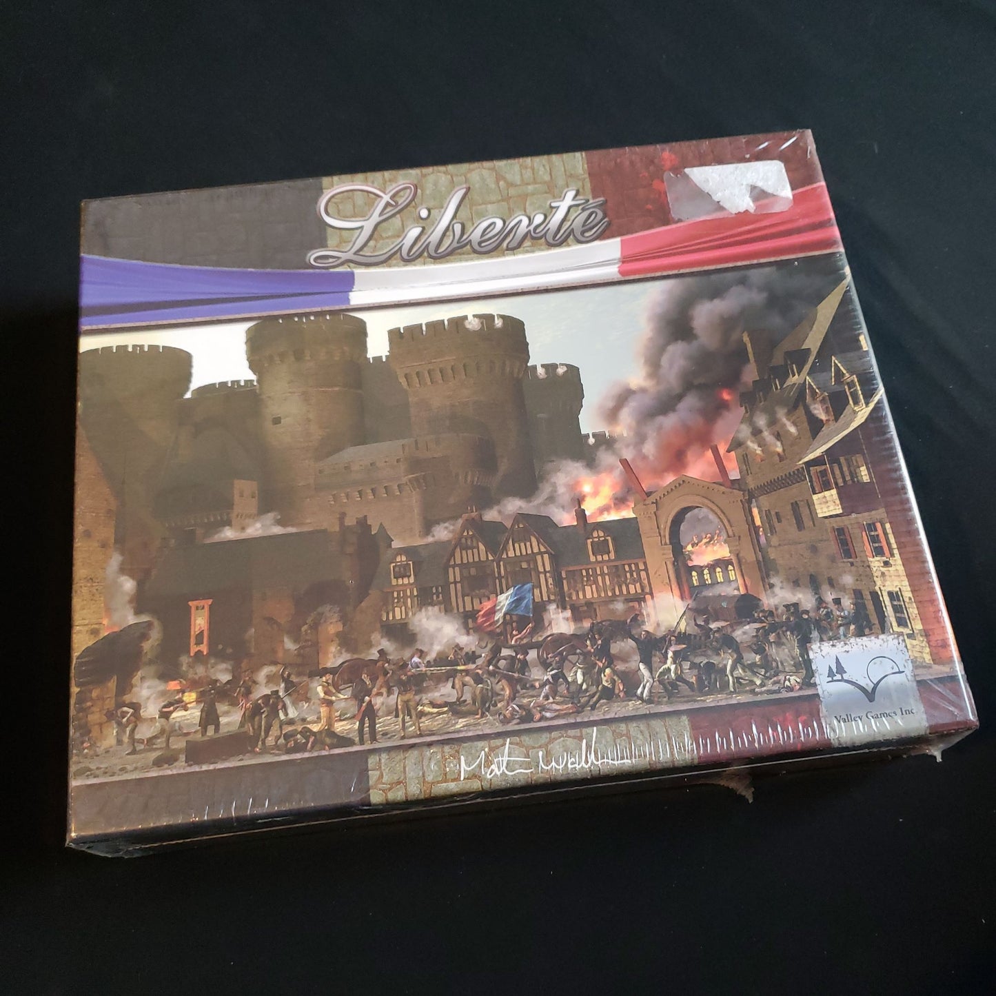 Image shows the front cover of the box of the Liberte board game
