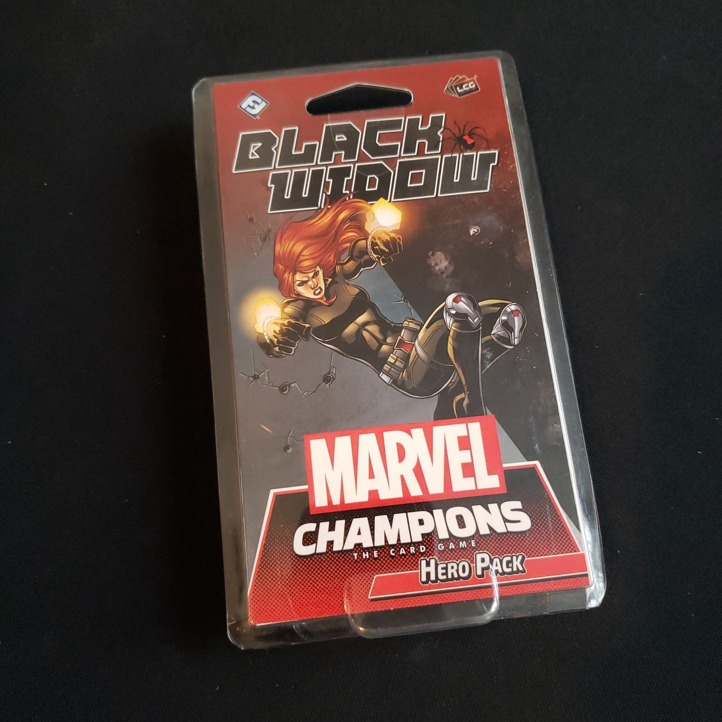 Image shows the front of the package for the Black Widow Hero Pack for the Marvel Champions card game