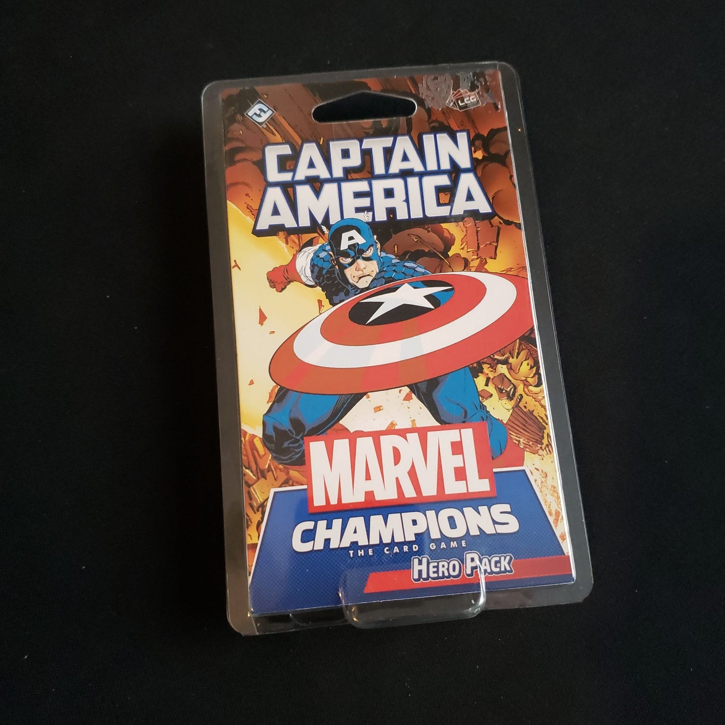 Image shows the front of the package for the Captain America Hero Pack for the Marvel Champions card game