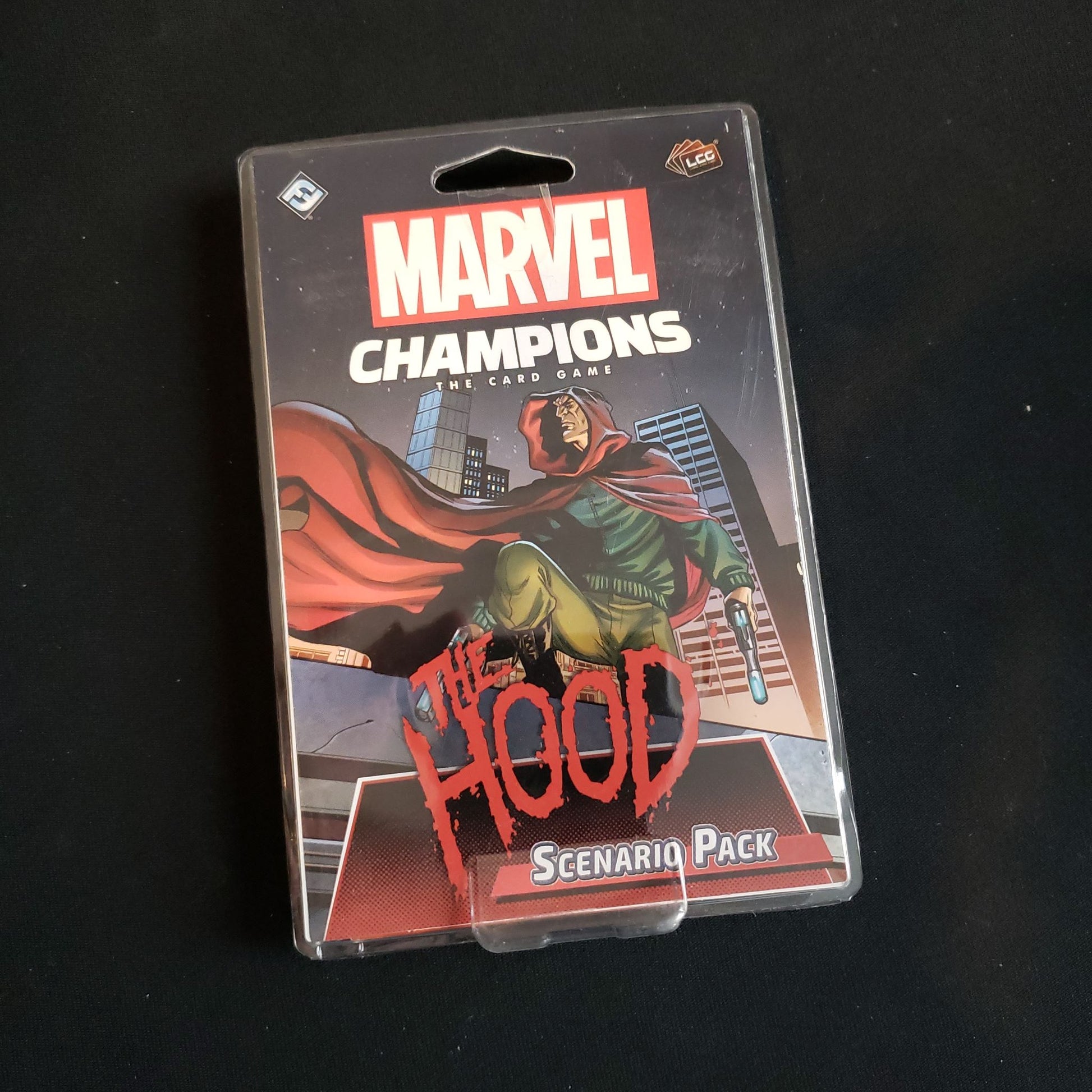 Image shows the front of the package for the Hood Scenario Pack for the Marvel Champions card game