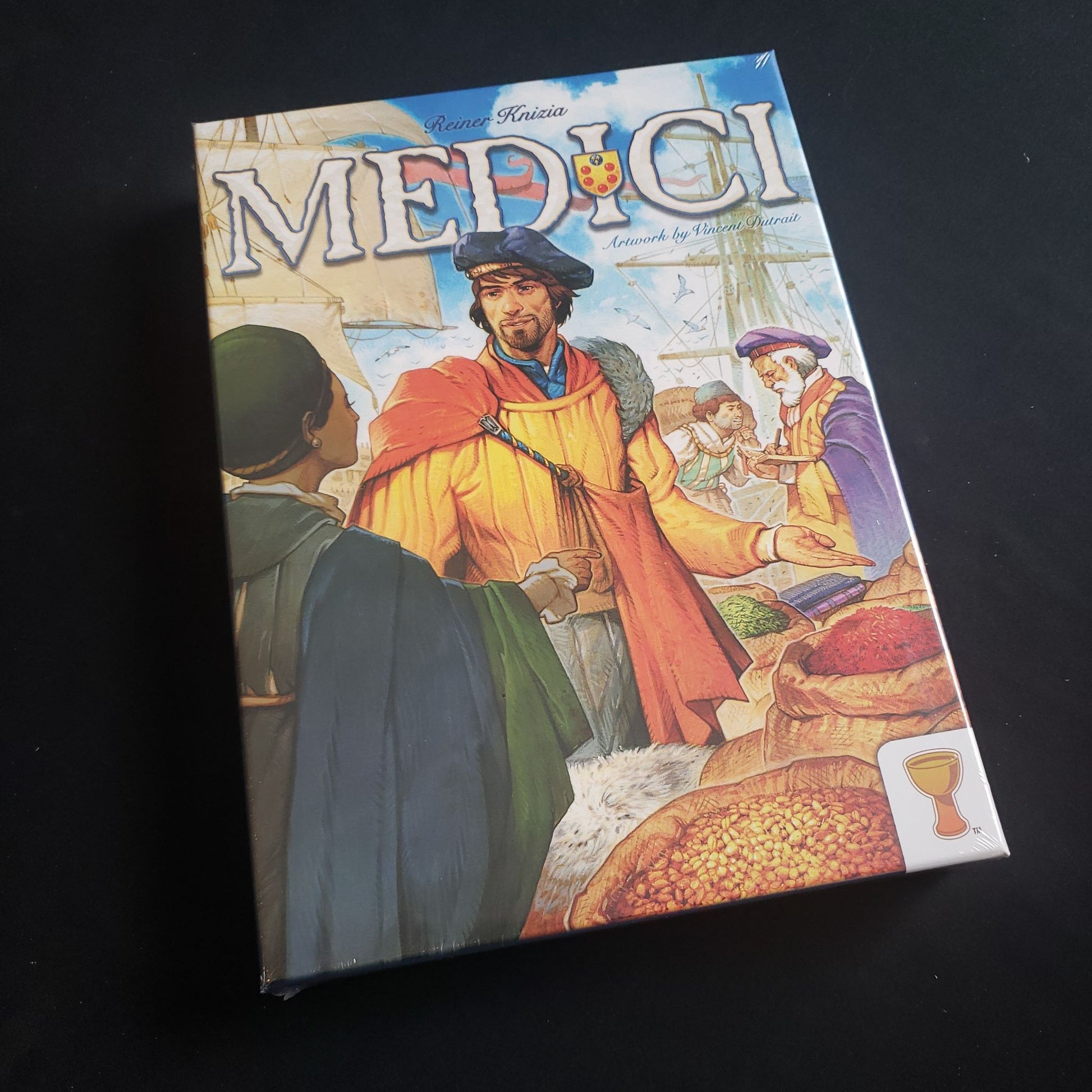 Image shows the front cover of the box of the Medici board game