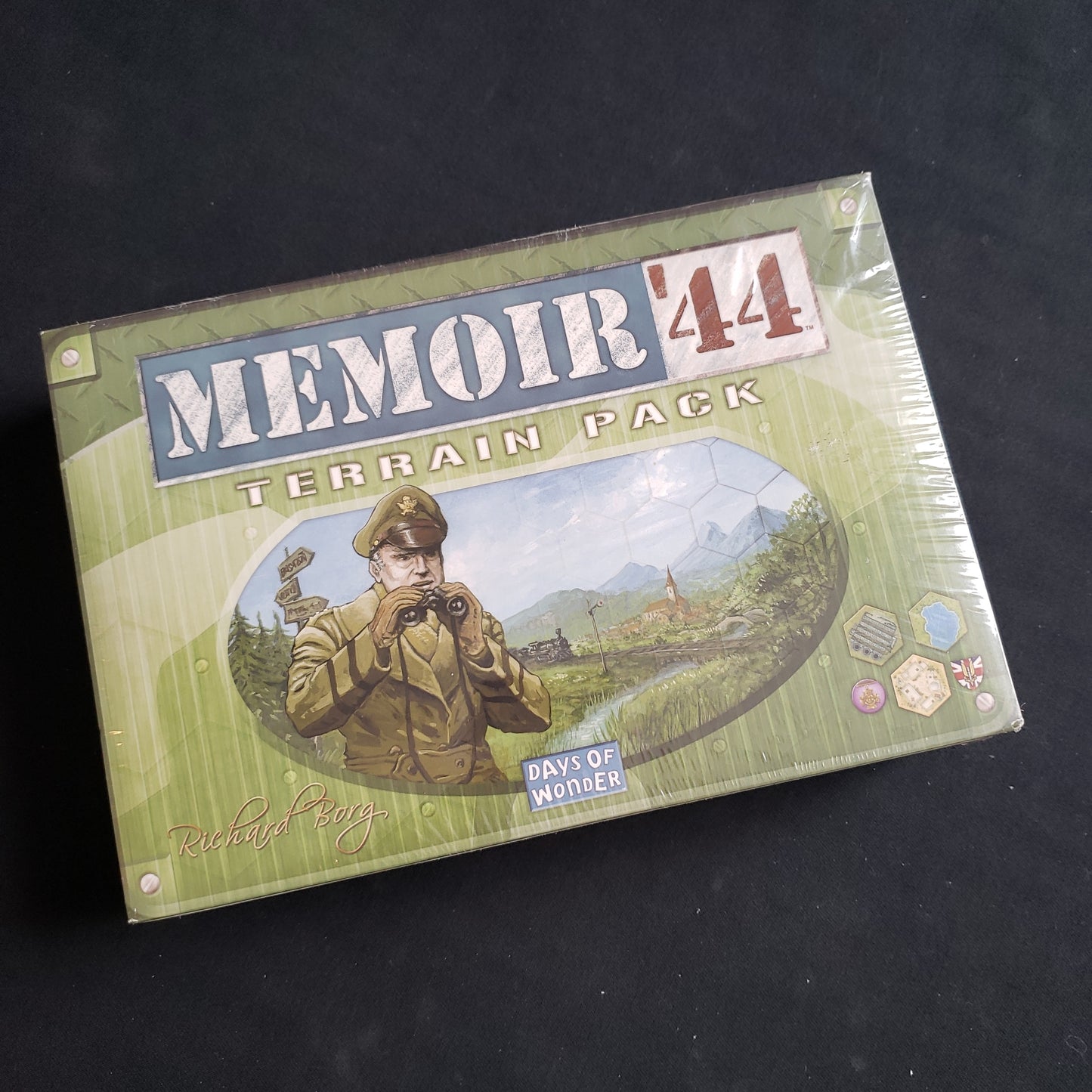 Image shows the front cover of the box of the Terrain Pack expansion for the Memoir 44 board game