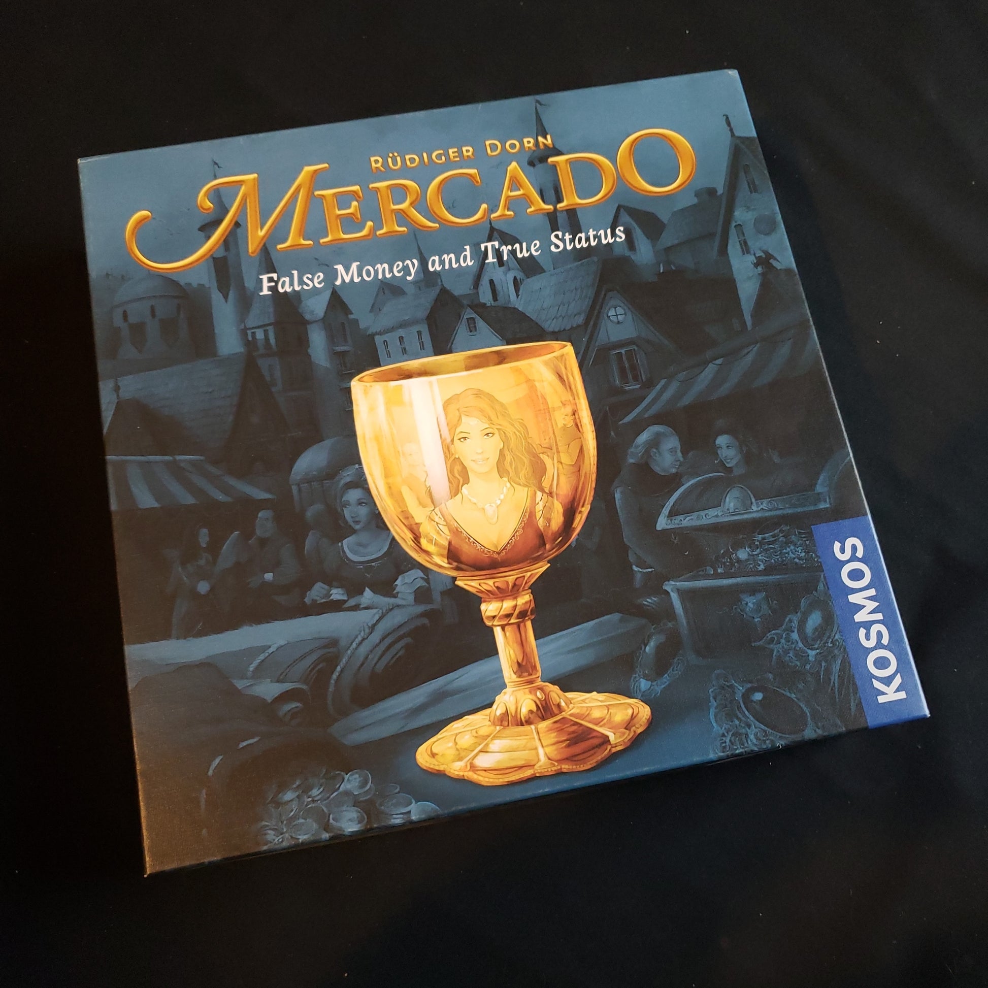 Image shows the front cover of the box of the Mercado board game