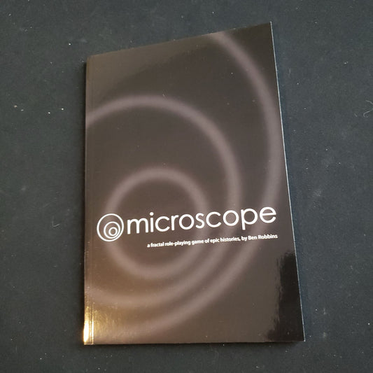 Image shows the front cover of the Microscope roleplaying game book