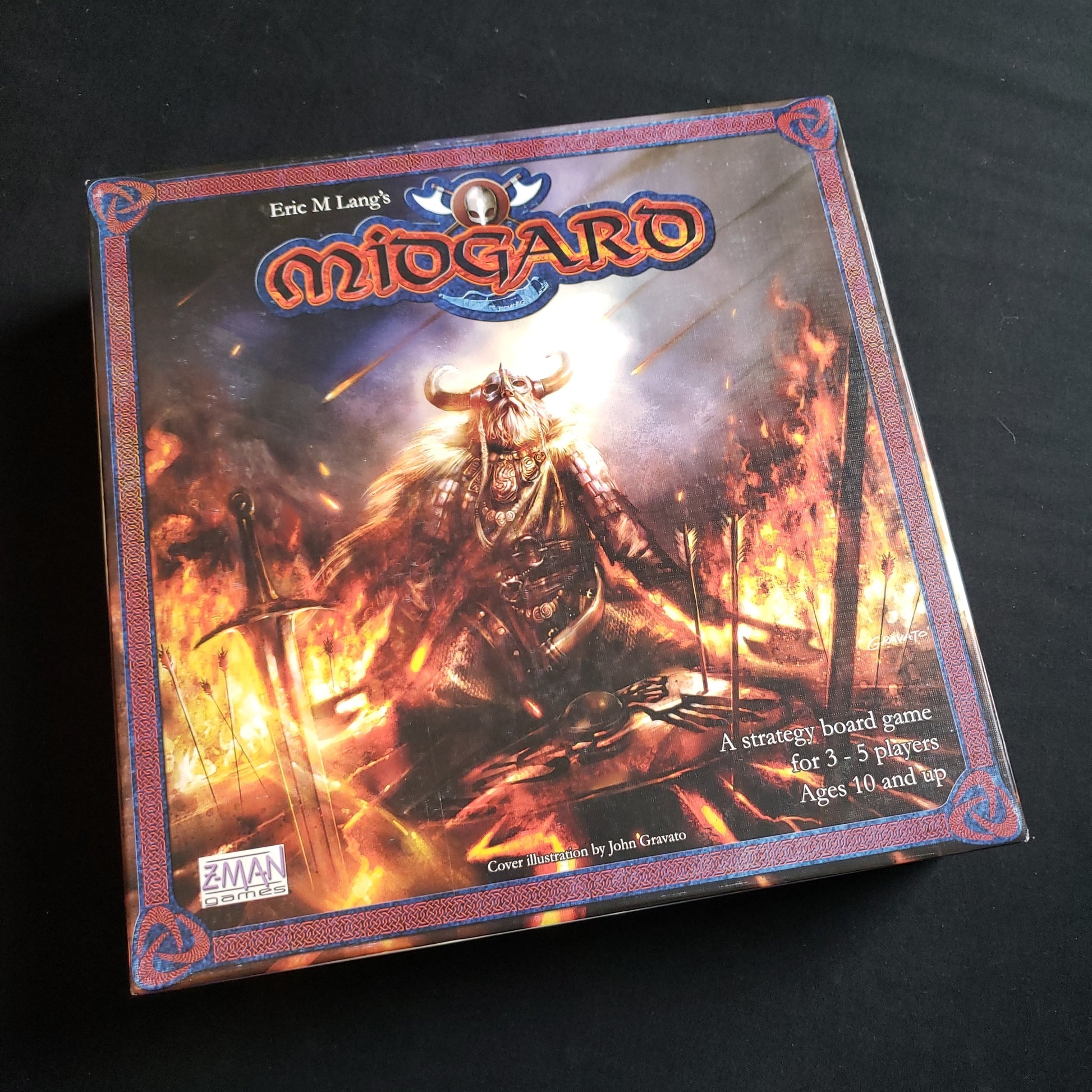 Image shows the front cover of the box of the Midgard board game