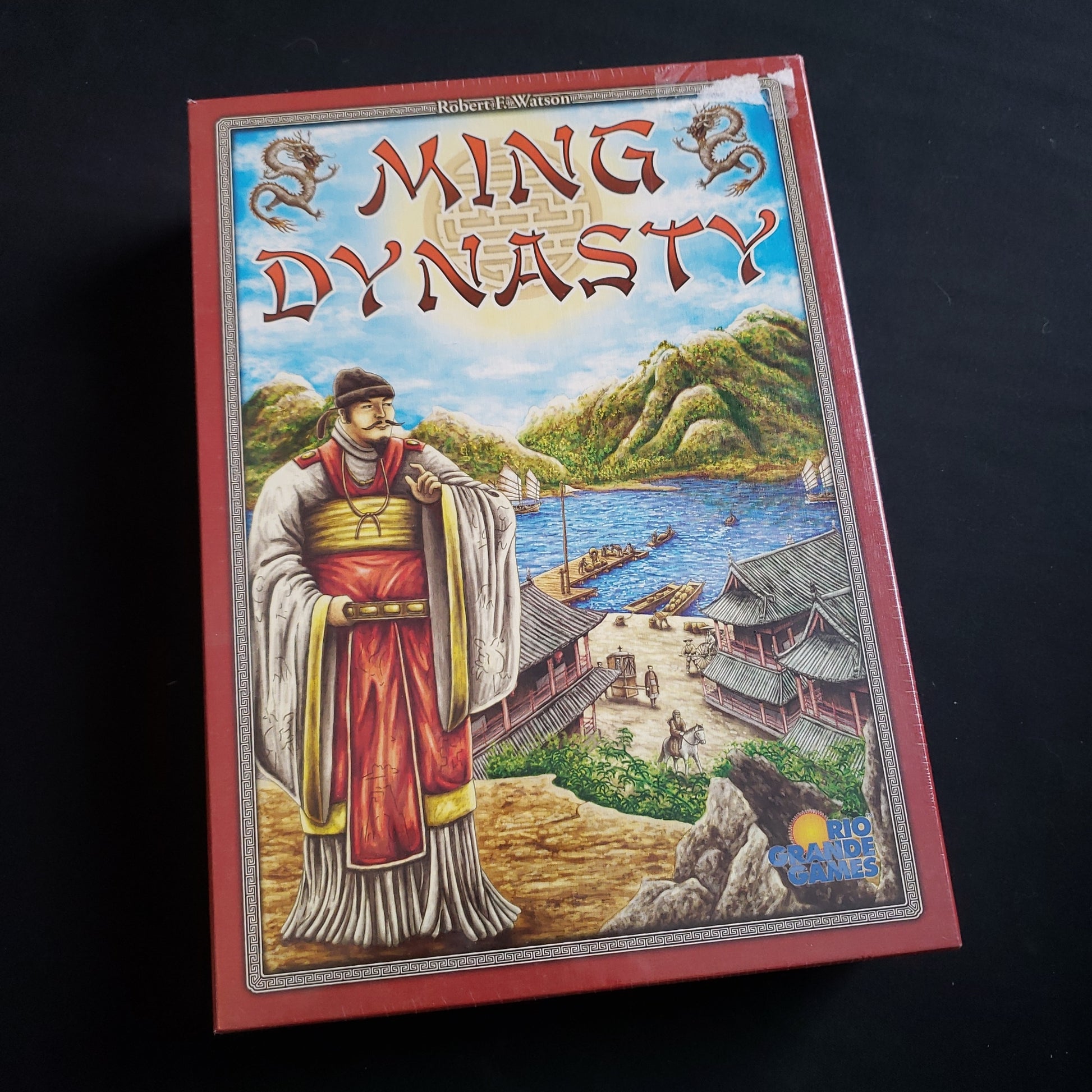 Image shows the front cover of the box of the Ming Dynasty board game
