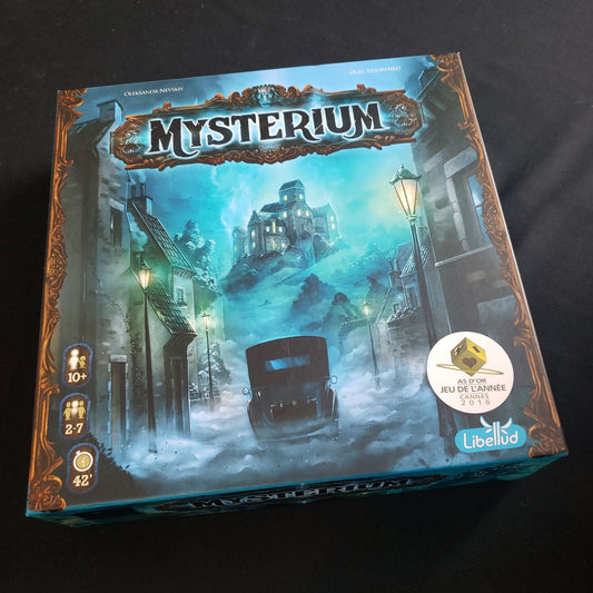 Image shows the front cover of the box of the Mysterium board game