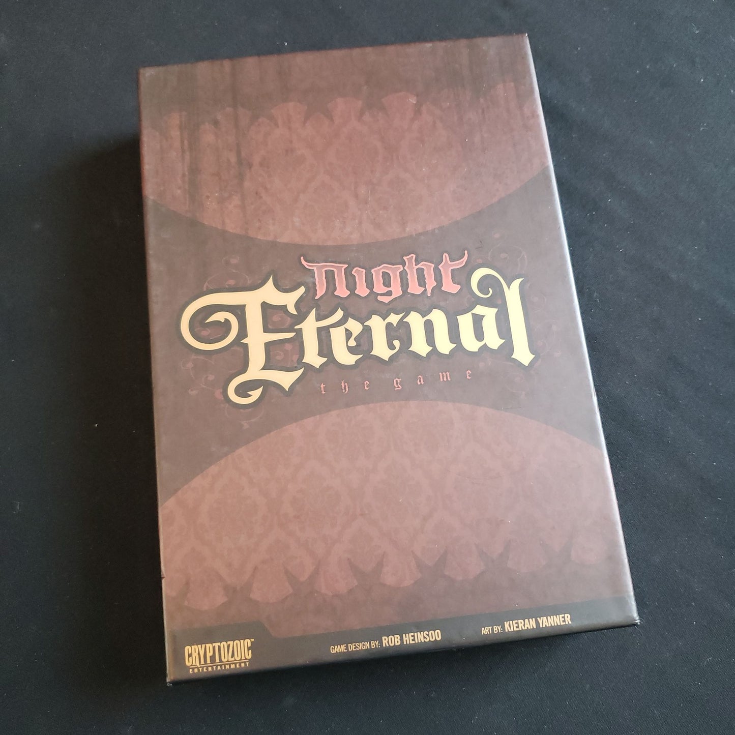 Image shows the front cover of the box of the Night Eternal card game