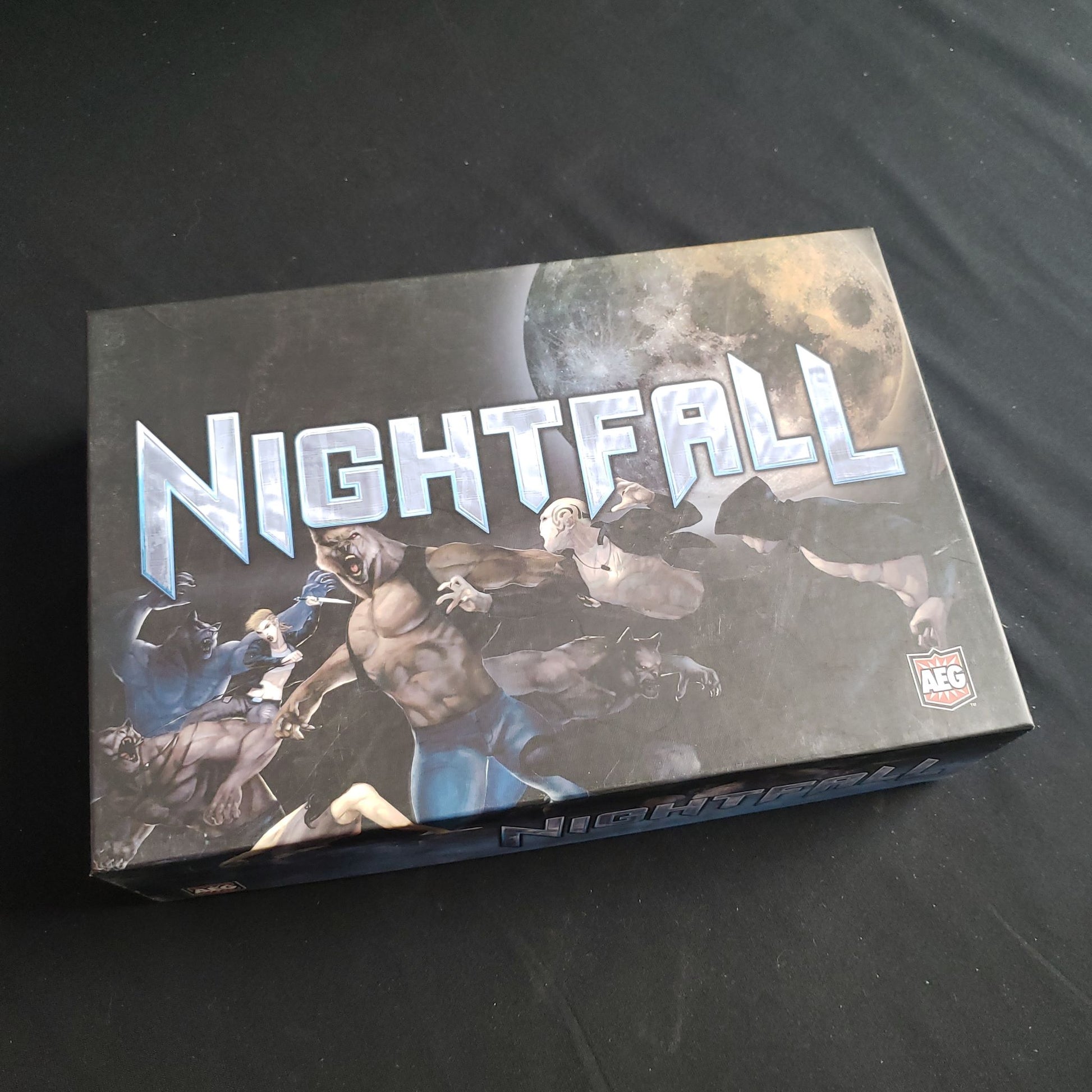 Image shows the front cover of the box of the Nightfall card game